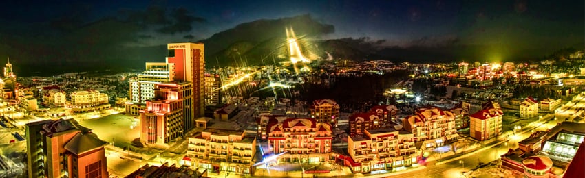 Illuminated mountain city at night near Paektusan Geopark